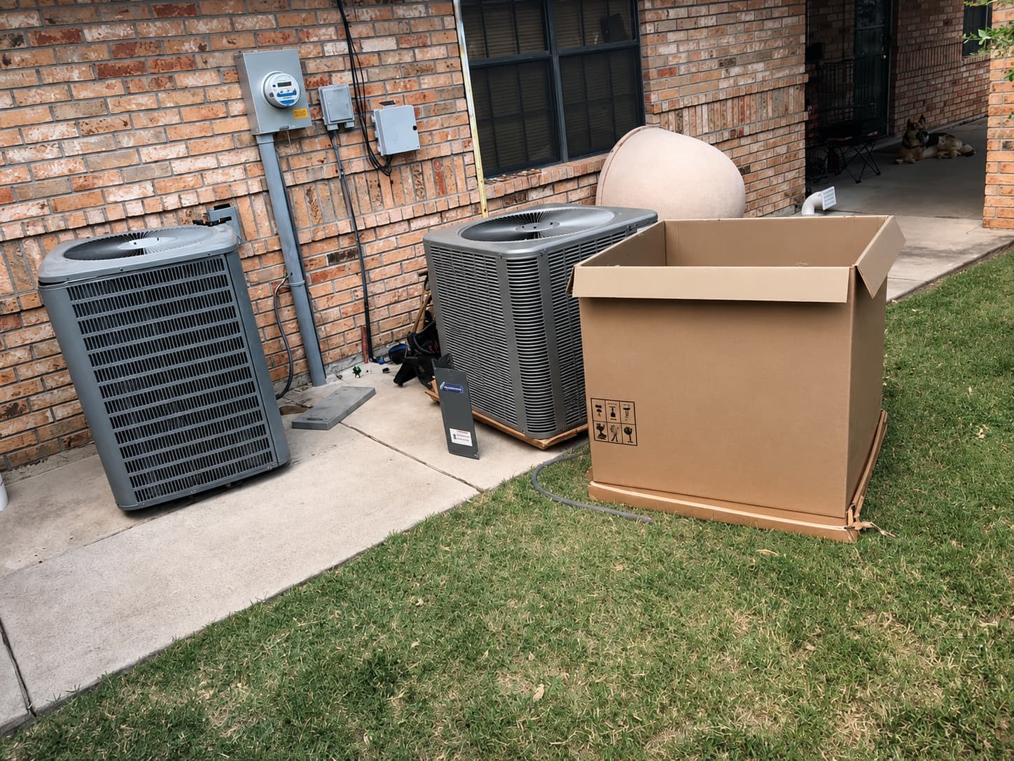 Technician cleaning an AC condenser coil in Harlingen